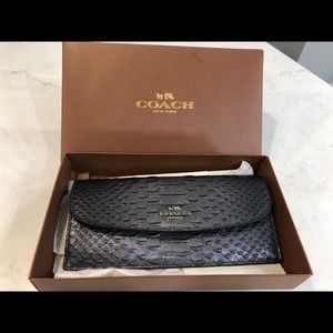 Brand new coach wallet. Dark silver metallic with silver outside zipper